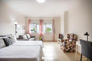 Ένα ή περισσότερα κρεβάτια σε δωμάτιο στο Home2Book Peaceful Getaway in Bajamar