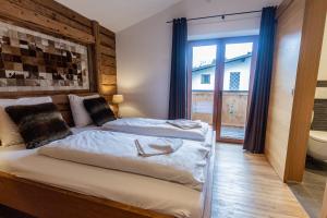 Ένα ή περισσότερα κρεβάτια σε δωμάτιο στο Chalet Hohe Tauern - Steinbock Lodges