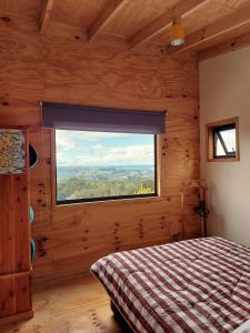 Postel nebo postele na pokoji v ubytování Casa Puente de Chiloé