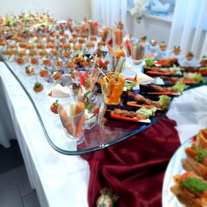 a long table with many plates of food on it at Eventhaus Schamin in Erpen