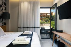 Televiisor ja/või meelelahutuskeskus majutusasutuses Chapter 02 Gallery Suites