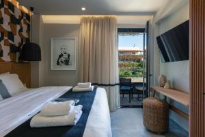 Voodi või voodid majutusasutuse Chapter 02 Gallery Suites toas