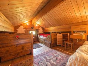 a log cabin with a bedroom and a bed at Charming chalet in Durbuy near adventure valley in Durbuy