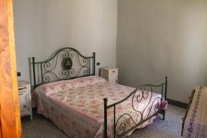 a bedroom with a bed and two night stands at Montegrazie Apartment in Imperia