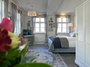 Ein Bett oder Betten in einem Zimmer der Unterkunft Boutique-Hotel Stadtvilla Hodes
