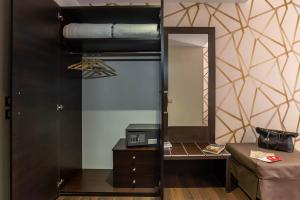 Postel nebo postele na pokoji v ubytování Catone District Hotel