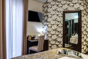 Postel nebo postele na pokoji v ubytování Catone District Hotel