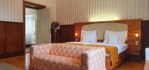 Postel nebo postele na pokoji v ubytování Hotel Okresní Dům