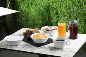 a table with a tray of food and drinks on it at Athens21 in Athens