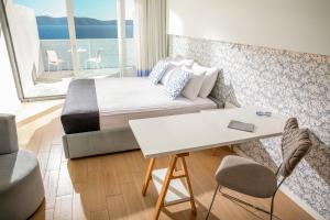 Posteľ alebo postele v izbe v ubytovaní TUI BLUE Makarska - Adults Only