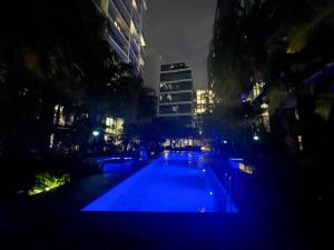 a pool of blue lights in a city at night at 1.5BR apartment Fortitude Valley in Brisbane