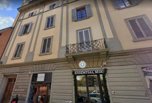 a building with a sign in front of a store at Casa del Sarto in Florence