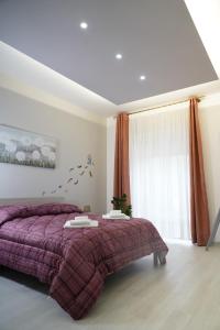 Postel nebo postele na pokoji v ubytování PONTE VALLE B&B POMPEI