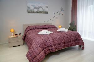 Postel nebo postele na pokoji v ubytování PONTE VALLE B&B POMPEI