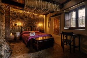 Postel nebo postele na pokoji v ubytování B&B La Voce del Fiume Dimora storica di Charme
