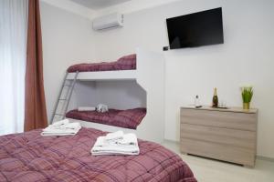 Postel nebo postele na pokoji v ubytování PONTE VALLE B&B POMPEI
