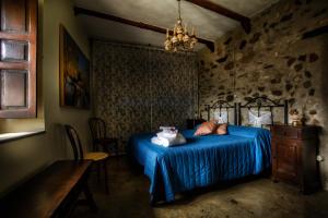 Postel nebo postele na pokoji v ubytování B&B La Voce del Fiume Dimora storica di Charme