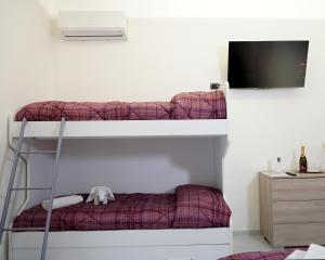 Postel nebo postele na pokoji v ubytování PONTE VALLE B&B POMPEI