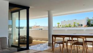 a dining room with a table and chairs at Pacha Hotel in Ibiza Town