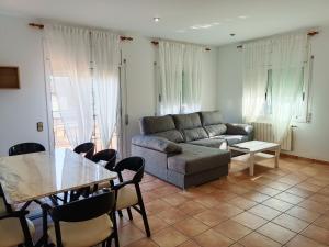A seating area at Bright Villa in Vidreres with Private Pool and Jacuzzi