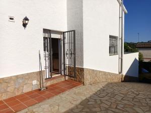 A balcony or terrace at Bright Villa in Vidreres with Private Pool and Jacuzzi