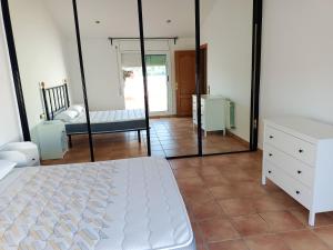 A bed or beds in a room at Bright Villa in Vidreres with Private Pool and Jacuzzi