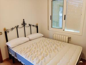 A bed or beds in a room at Bright Villa in Vidreres with Private Pool and Jacuzzi