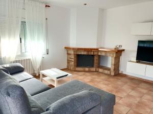 A television and/or entertainment centre at Bright Villa in Vidreres with Private Pool and Jacuzzi