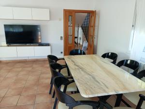 A television and/or entertainment centre at Bright Villa in Vidreres with Private Pool and Jacuzzi