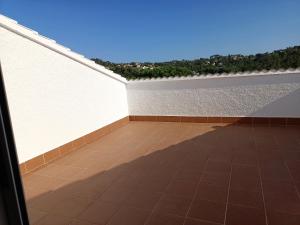 A balcony or terrace at Bright Villa in Vidreres with Private Pool and Jacuzzi