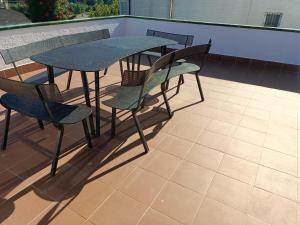 A balcony or terrace at Bright Villa in Vidreres with Private Pool and Jacuzzi