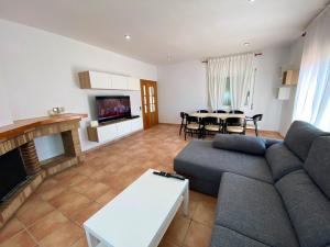 A seating area at Bright Villa in Vidreres with Private Pool and Jacuzzi