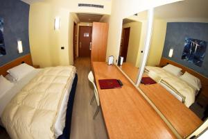 Uma cama ou camas num quarto em Best Western Hotel Class Lamezia