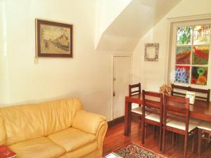 a living room with a couch and a table at Tralkan B&B in Santiago