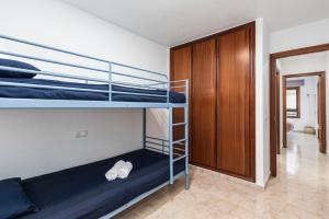 Posteľ alebo postele v izbe v ubytovaní MEDANO4YOU Los Viajeros Holiday Home