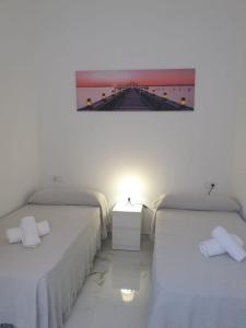 Postel nebo postele na pokoji v ubytování Confort Apartamento 2 dormitorios