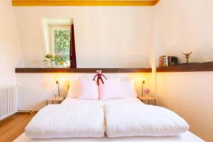 Postel nebo postele na pokoji v ubytování Hotel Beau Séjour Lucerne