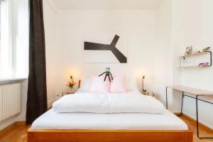 Postel nebo postele na pokoji v ubytování Hotel Beau Séjour Lucerne
