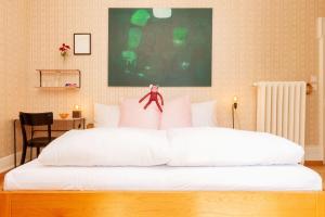 Postel nebo postele na pokoji v ubytování Hotel Beau Séjour Lucerne