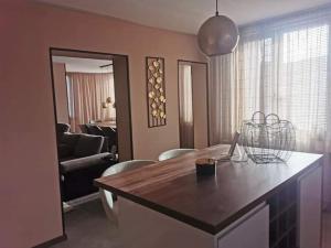 a kitchen with a table and a living room at Casa Veneta in Oreshak