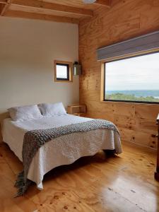 Postel nebo postele na pokoji v ubytování Casa Puente de Chiloé