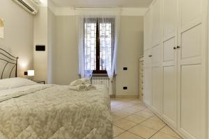 Posteľ alebo postele v izbe v ubytovaní Classic Apartment in Re Di Roma near the metro