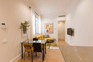 A television and/or entertainment centre at ISG Apartments Cedaceros 12