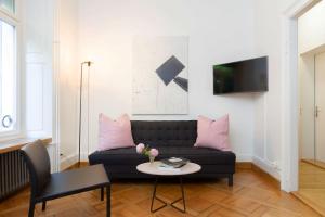 TV a/nebo společenská místnost v ubytování Hotel Beau Séjour Lucerne
