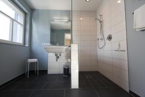 a bathroom with a sink and a shower at Ferienhaus Christina in Bad Windsheim +4 photos