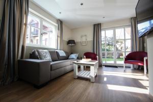 a living room with a couch and a table at Ferienhaus Christina in Bad Windsheim