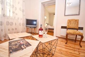 A television and/or entertainment centre at Traditional House with Ivy Garden