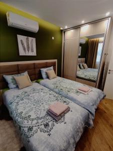 Säng eller sängar i ett rum på XIO Apartments