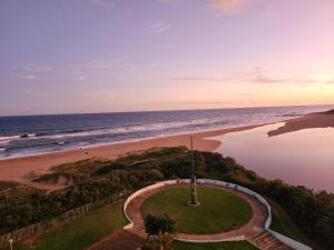 an aerial view of the beach and the ocean at Beachside 3 bed apartment with stunning seaviews in Amanzimtoti