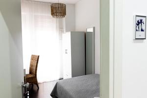 Postel nebo postele na pokoji v ubytování Elisir B & B